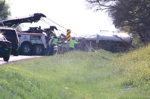 The March 22 collision involving a Hays Consolidated Independent School District bus carrying adults and preschoolers and a cement truck claimed the lives of a 5-year-old boy and an adult. The driver is being charged with criminally negligent homicide.   Photo by Jason Hennington 