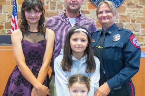 Vicky Steffanic (right) celebrates with her family after being named chief of police during the Bastrop City Council meeting April 11. Also pictured are her husband, Matthew Steffanic; and daughters, Ryan, Kinsey and Olivia Steffanic. Courtesy photo / City of Bastrop