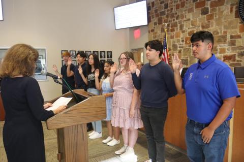 Mayor Connie Schroeder swears in the newest members of the Bastrop Youth Advisory Council during the City Council meeting Aug. 23. As stated in the resolution, the municipal government has an interest in supporting opportunities for youth activites and leadership in Bastrop and the county and therefore has recognized the need to promote an action-civics curriculum. Pictured are Michael Svetlik, Benjamin Zhu, Venus Vega, Gabriella Lozano, Brandy Lyles, Isaiah Molina and Joel Briones. Facebook / City of Bas