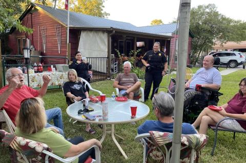 Residents on Taylor Road talk with Elgin Police Department officers during National Night Out in Elgin Oct. 4. Facebook / Elgin Police Department - Texas