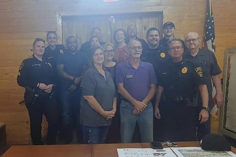 Chief Chris Noble (second from right) stands with fellow officers and others at the Elgin Chamber of Commerce during National Night Out in Elgin Oct. 4. Facebook / Elgin Police Department - Texas
