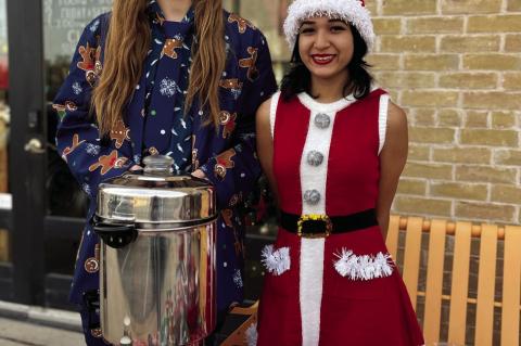 Hadyn Carnus and Elyse Olvera manning Remember Me Tattoos’ hot cocoa station.