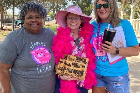 Amy Miller (center) stands with Mayor Theresa McShan (left) and Hogeye Festival Co-Chair Stacy Wilhite after Miller is inducted into the Hogeye Festival Hog of Fame Oct. 22 in Elgin. Courtesy photo