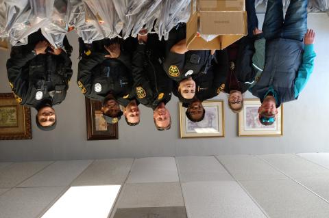 Members of the Elgin Police Department participate in a food drive in Elgin Nov. 13. Pictured are front, Lucy Dominguez; and back, from left, Tony Altgilbers, Amy Altgilbers, Tametra Cook, Chief Cris Noble, Lindsey Scheffler, Christian Baldwin, Marco Solorio.  Courtesy photo