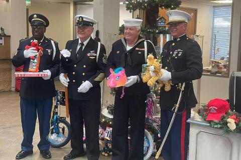 T.J. Jenkins, Bert Cruise, Bob Prendergast and John Hobbs, of the Bastrop County Veterans Honor Guard, delivered items to Frontier Bank’s Toys for Tots collection this past week. The United States Marine Corps has long been affiliated with the donation-based program. Photo courtesy John Hobbs 
