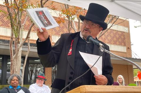 “Rob Morriss Elgin” helps describe items going into Elgin’s Sesquicentennial time capsule during a dedication ceremony Dec. 3. Photo by Fernando Castro