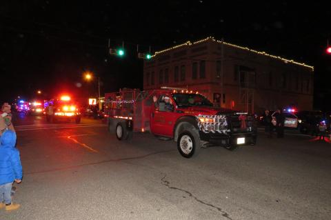 An Elgin Fire Department truck travels down Main Street in Elgin Dec. 3 for the Elgin Lighted Parade. Photo by Fernando Castro
