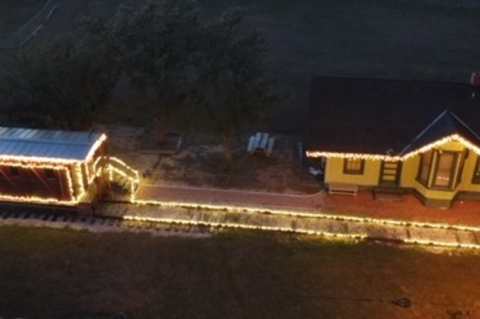 Coupland’s historic Depot and caboose shown here after being decorated by Jonathan Jones. Drone photo by Max Marosko III / RaptAir