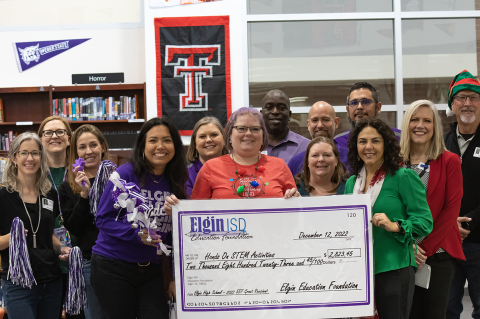 Superintendent Jana Rueter (second from right) and members of the Elgin Education Foundation deliver more than $35,000 in Innovative Teaching grants to Elgin ISD educators Dec. 12, including a $2,823 grant for hands-on STEM activities at Elgin High School.   Courtesy photo / Elgin ISD