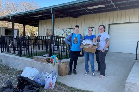 Hayley Hundall (center), Austin Wildife Rescue executive director, and volunteers accept donations at their Elgin facility Dec. 15. Courtesy photo