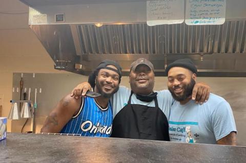 Sherman Scales (center) and sons Sherman III (left) and Leonard (right) in the cafe’s kitchen.   Photo courtesy of Scales’ Cafe