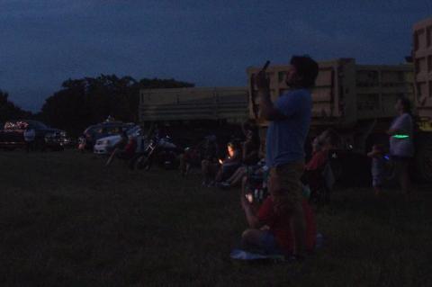 Spectators in the field north of the VFW Hall have a front-row seat from which to watch the fireworks show July 3, 2019.   File photo