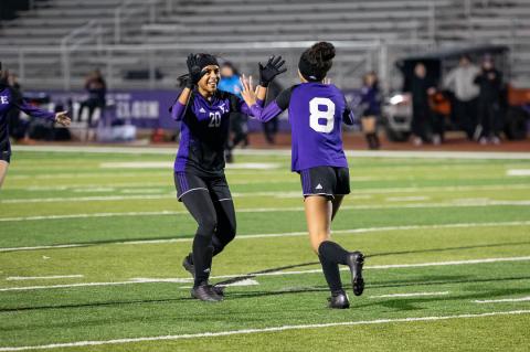 Dory Estra (left) and Kailyn Cook (right) come together after a Wildcats goal. Both players will return as key pieces in 2023. Photo courtesy of Taylor Cansler