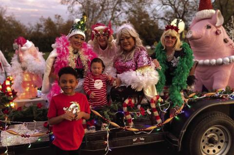 Brothers RJ Williams (left) and Kai Tee Garza hang out with the Elgin Sowpremes before the lighted Christmas parade Saturday. Courtesy photo
