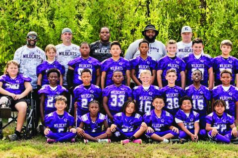 The 2023 Elgin Youth Football and Cheer Junior Football players pose with coaches. Photo courtesy of Ron Ramirez