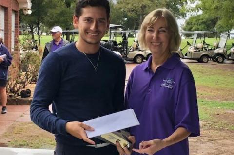 Carlos Tercero of Covert Hutto poses with Ruth Hyatt after his team placed first in the Relay For Life of Elgin Golf Tournament. Photo courtesy of Ruth Hyatt