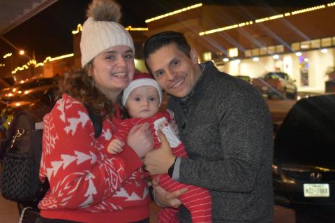Ani, Micah and Victor Navarro enjoy downtown’s holiday-themed festivities while sporting Christmas attire. Photo by Quinn Donoghue