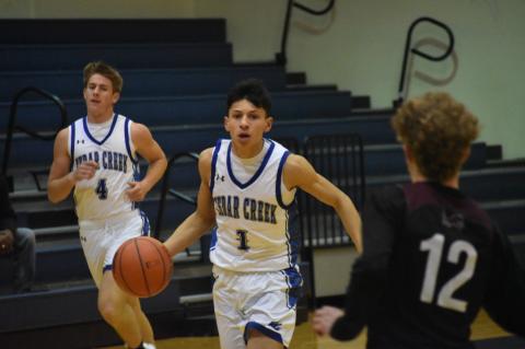 Eagles point guard Robert Conrad leading a fast-paced offensive attack against Lockhart. Conrad emerged as a top-notch player during the 2021-22 season and has taken another step forward this year. Photo by Quinn Donoghue