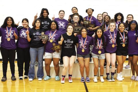 The Elgin High School girls varsity powerlifting team proudly poses together March 4 after winning the THSWPA regional powerlifting meet. Photo by Erin Anderson