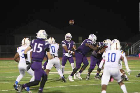 Elgin High School varsity football senior quarterback Nathen Lewis (1) throws the ball to junior wide receiver Blake Thames (15) during the Wildcats’ 44-17 district victory Oct. 20 over Pflugerville High School. Photo by Zoe Grames