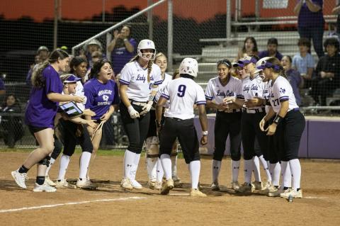 Elgin High School varsity softball celebrates a home run by Jaylan Roberson during the Lady Wildcats’ victory March 24 over Pflugerville High School. Photo by Erin Anderson