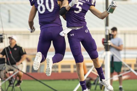 Justin Strong (right) and Leo Ochoa celebrate after Strong’s 47-yard touchdown reception. Photo by Erin Anderson