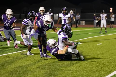 Elgin linebacker Cameron Hardy bringing down a Waco ball carrier.  Photo by Erin Anderson