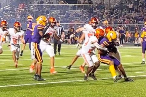 The Smithville defense gang tackling a La Grange ball carrier for a crucial stop in the third quarter.  Photo by Megan Hancock