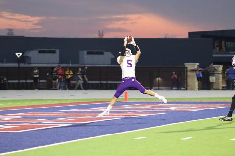Justin Strong makes a leaping catch, cashing in one of his two touchdowns of the game.  Photo by Zoe Grames.