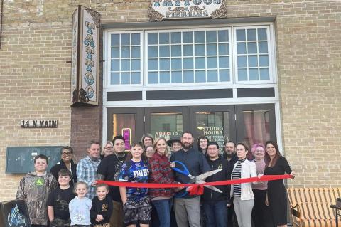 The Elgin Chamber of Commerce and downtown Elgin’s Remember Me Tattoos celebrate their renovated shop with a ribbon cutting ceremony. Photo courtesy of Veronica Seever