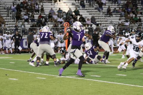 Wildcats varsity football senior quarterback Nathen Lewis throws to a receiver downfield on Sept. 22 during Elgin’s 50-28 victory on Homecoming over Pflugerville Connally High School. Photo by Zoe Grames