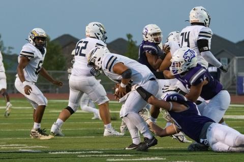 Elgin varsity football senior defensive end Rogelio Huitron (10) sacks the opposing quarterback on Sept. 1 during the Wildcats’ 47-0 win at home vs. Akins. Photo by Marcial Guajardo