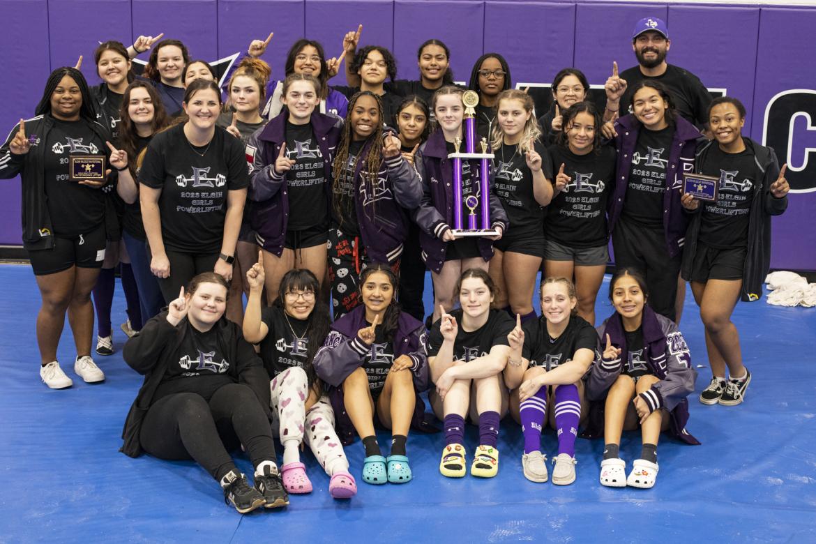 The Elgin girls powerlifting team celebrates after winning first place at the Elgin Wildcat Invitational. Photo by Erin Anderson