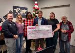 CAC Board Treasurer Eric Farley, CAC Board President Val Butcher, community member Sumai Lokumbe, Lost Pines Toyota Dealer Principal Carlos Liriano, CAC Executive Director Meagan Webb and Director of the Honor Choir Bill Owens with the sizable donation. Photo courtesy Lost Pines Toyota 