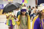 Melanie Sanchez dons festive Mardi Gras attire for the EES parade last Tuesday. Photo by Erin Anderson