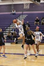 Elgin High School girls varsity basketball senior Keera Williams (5) puts up a shot over a defender Jan. 9 during the Lady Wildcats’ lopsided 47-17 victory at home versus Cedar Creek High School. Photo by Erin Anderson