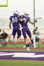 Justin Strong (right) and Leo Ochoa celebrate after Strong’s 47-yard touchdown reception. Photo by Erin Anderson