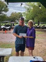 Robert Justice of TriCounty Feed accepts the second place reward from Ruth Hyatt following the Relay For Life of Elgin Golf Tournament. Photo courtesy of Ruth Hyatt